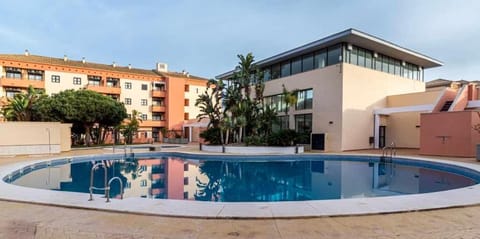 Apartamento junto a la playa con piscina y parking Condo in Punta Umbría