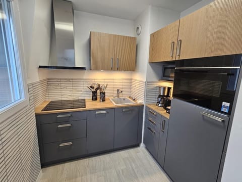 Kitchen or kitchenette, dishwasher, oven, stove