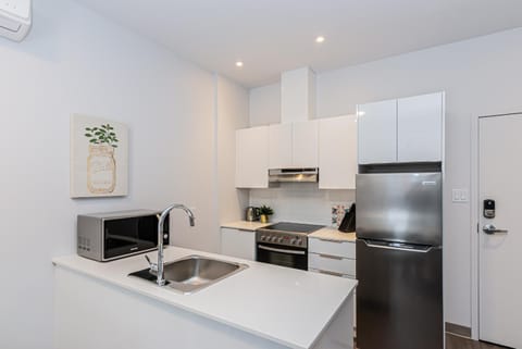 New and Perfectly Located 1 Bedroom Apartment by Den Stays Condo in Laval