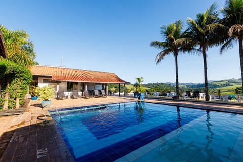 Property building, Day, Natural landscape, Pool view, Swimming pool, sunbed