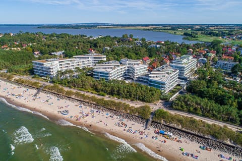 Property building, Nearby landmark, Communal lounge/ TV room, Day, People, Natural landscape, Bird's eye view, Beach, Evening entertainment, City view, Sea view, group of guests