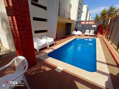 Property building, Patio, Day, Pool view, Swimming pool, sunbed