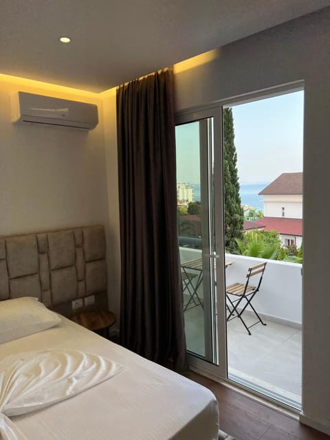 Bed, View (from property/room), Balcony/Terrace, Seating area, Bedroom, Sea view