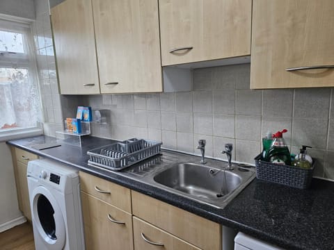 Kitchen or kitchenette, dishwasher, minibar, stove, washing machine, dryer