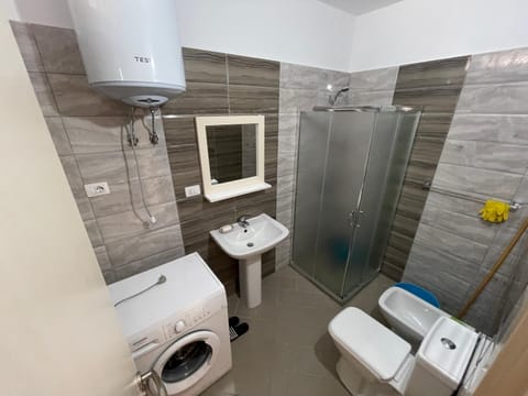 Shower, Toilet, Bathroom, bidet, towels, washing machine, dryer