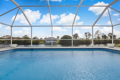 Waterfront Villa with Heated Pool - Villa Wine Down - Roelens Vacations House in Cape Coral