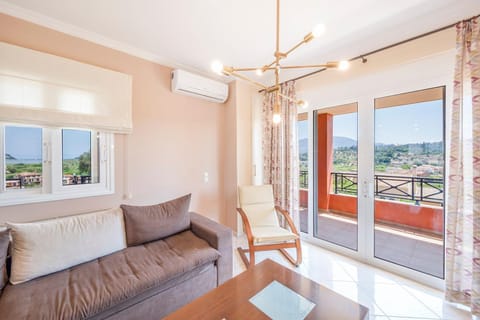 View (from property/room), Balcony/Terrace, Living room, Seating area, air conditioner