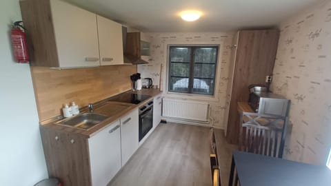 Kitchen or kitchenette, microwave, oven, stove