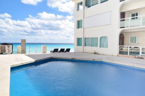 Property building, Patio, Day, Natural landscape, Pool view, Sea view, Swimming pool, sunbed