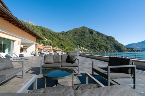 Property building, Patio, Nearby landmark, Day, Natural landscape, View (from property/room), Balcony/Terrace, Living room, Seating area, Lake view, Mountain view