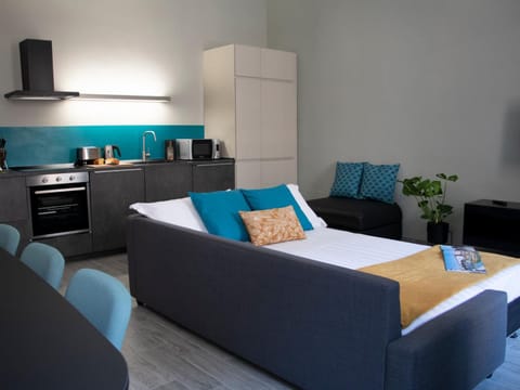 Bed, Living room, Seating area, kitchen