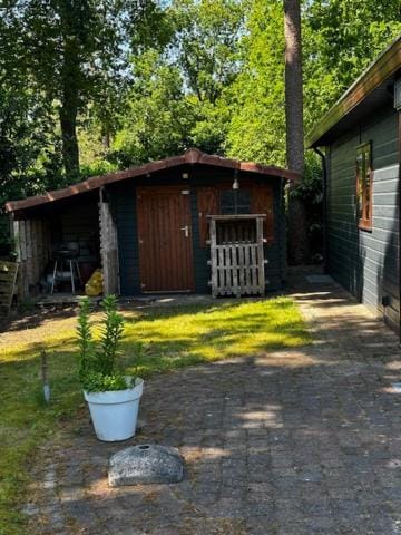 Dubbele chalet op recreatiepark Topparken op de Veluwe in Beekbergen met grote vrije tuin en eigen parkeerplaats House in Loenen