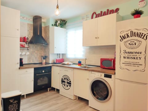 Kitchen or kitchenette, dishwasher, oven, stove, washing machine, dryer