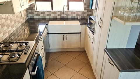 Kitchen or kitchenette, dishwasher, oven, stove, toaster