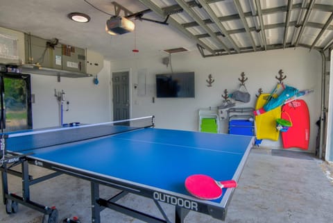 Salt Water Heated Pool Home with a Tiki Bar, a Garage Game Room and 4 Bikes House in North Naples
