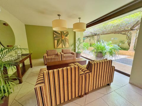 View (from property/room), Living room, Lobby or reception, Seating area, Garden view