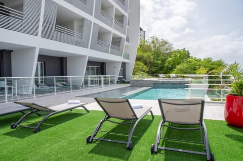 Property building, View (from property/room), Pool view, Swimming pool, sunbed