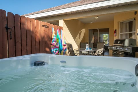 Heart of the Waves - 3BR & 2BA Beach Retreat - NEW HOT TUB - Outside Patio with Grill & Seating, Steps to Fun! House in Melbourne