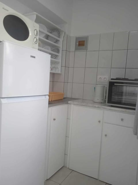 Kitchen or kitchenette, oven, stove