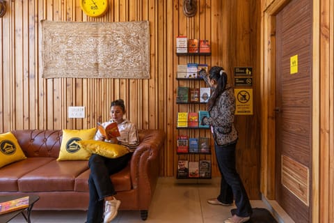 People, Library, Living room, Seating area, group of guests