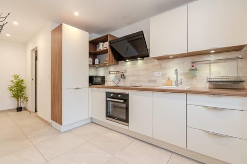 Kitchen or kitchenette, dishwasher, oven, stove, toaster