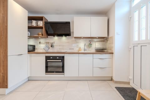 Kitchen or kitchenette, dishwasher, oven, stove, toaster