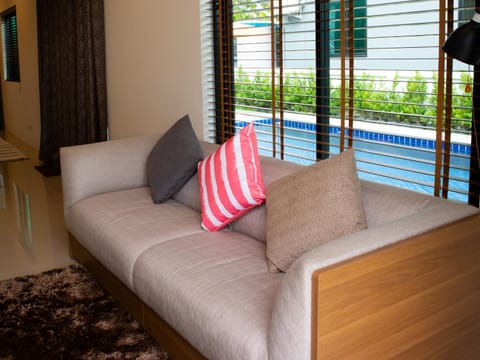 Living room, Seating area, Pool view