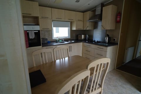 Dining area, dishwasher, microwave, oven, stove, toaster