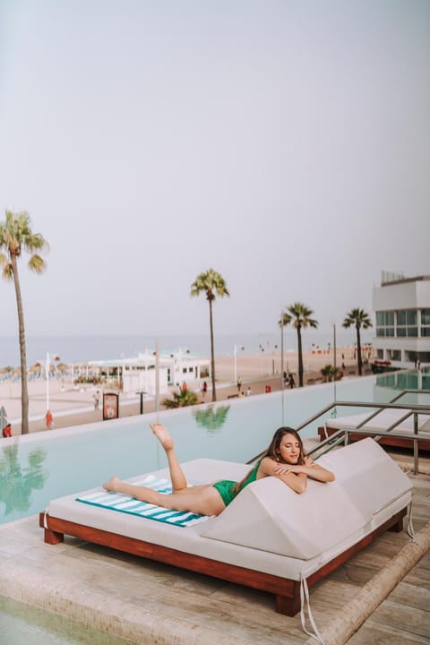 Day, People, Natural landscape, Beach, Guests, Pool view, Sea view, Swimming pool, group of guests, sunbed