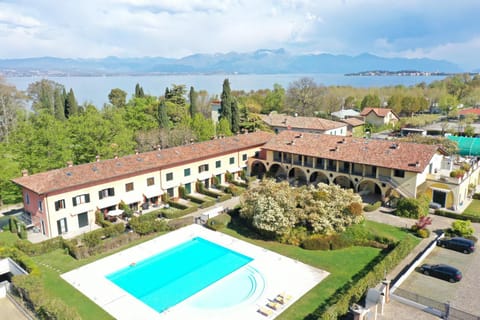 Property building, Natural landscape, Bird's eye view, Lake view, Swimming pool, Parking