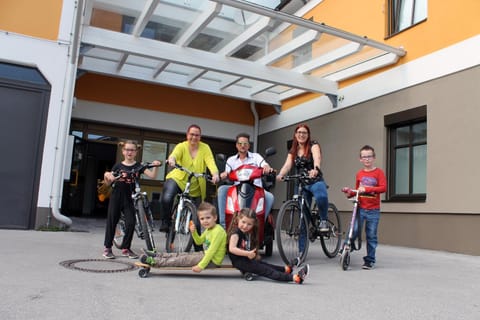 Patio, Facade/entrance, Spring, Day, Cycling, On site, young children, older children, group of guests, Family