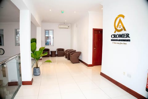 Property building, Property logo or sign, Lobby or reception, Seating area, Logo/Certificate/Sign, air conditioner