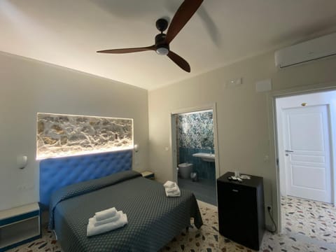 Bed, Photo of the whole room, Bedroom, towels, air conditioner