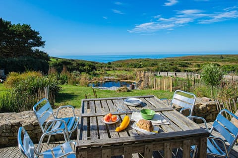 Natural landscape, View (from property/room), Dining area, Food, Sea view