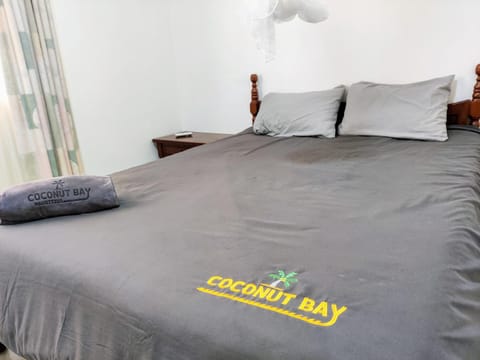 Bed, Property logo or sign, towels