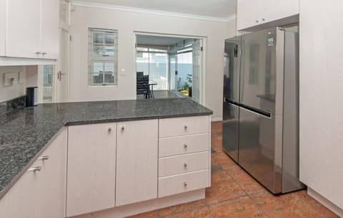 Kitchen or kitchenette, dishwasher, oven, stove