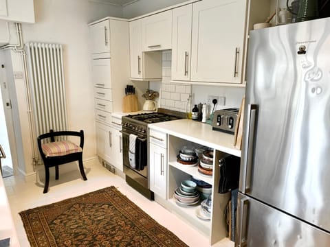 Kitchen or kitchenette, dishwasher, stove, toaster