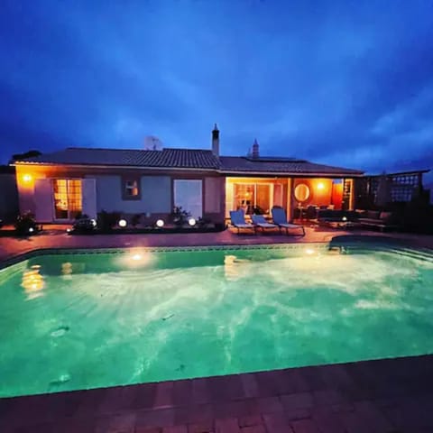 Property building, Patio, Night, Pool view, Swimming pool, sunbed