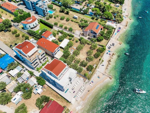 Property building, Nearby landmark, Natural landscape, Beach