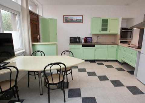 Dining area, dishwasher, oven, toaster, kitchen