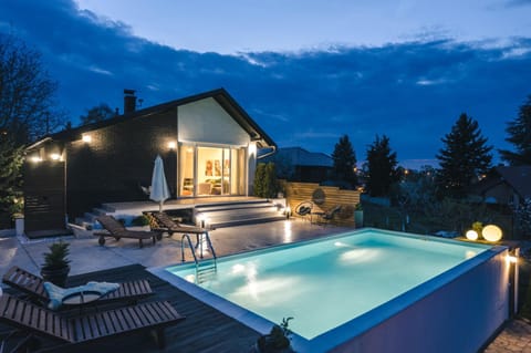 Property building, Patio, Night, Natural landscape, Pool view, Swimming pool, sunbed