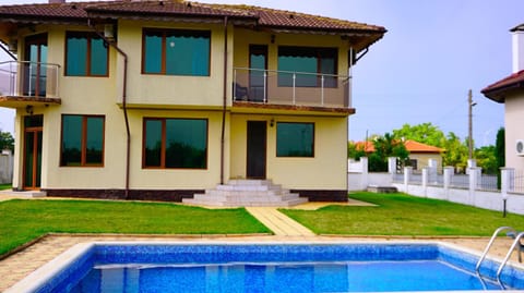 Property building, Patio, Garden, Swimming pool