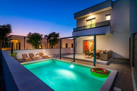 Property building, Swimming pool, Sunset