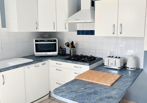 Kitchen or kitchenette, dishwasher, oven, stove, toaster