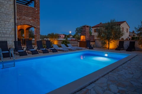 Property building, Patio, Night, Natural landscape, Pool view, Swimming pool, sunbed