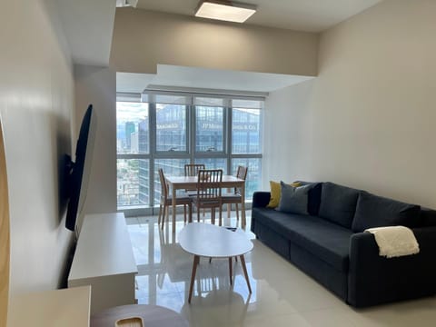 Bright 2-bedroom condo with pool in BGC Uptown Condo in Makati