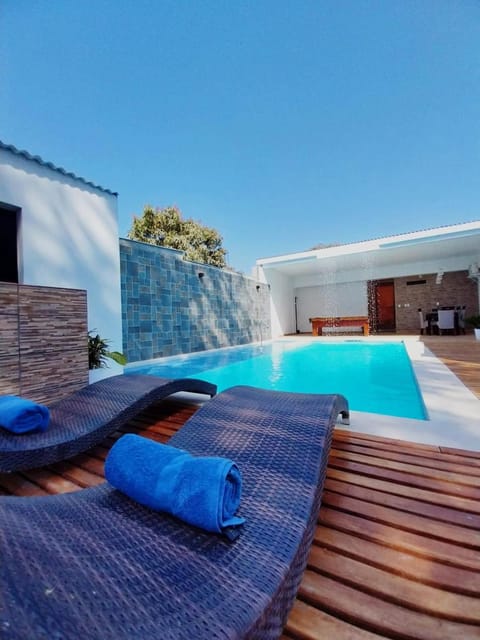 Patio, Natural landscape, Pool view, Swimming pool, sunbed, towels