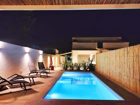 Patio, Night, Pool view, Swimming pool, sunbed