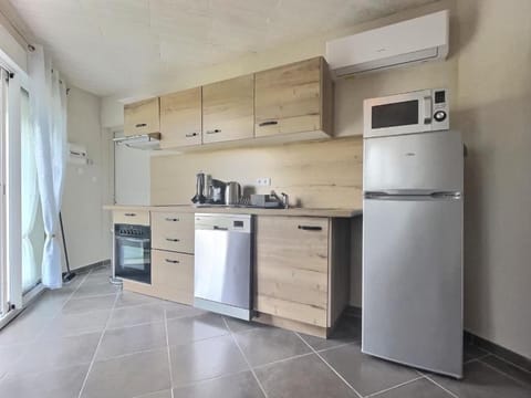 Kitchen or kitchenette, dishwasher, oven, stove, toaster