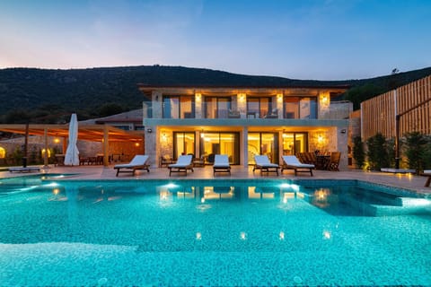 Property building, Patio, Night, Natural landscape, Mountain view, Pool view, Swimming pool, sunbed